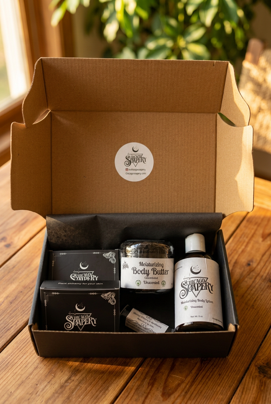 Open handmade gift box with two boxed soaps, body butter, lotion, and lip balm