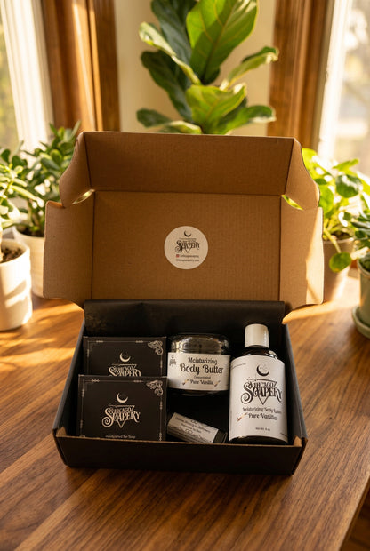Open Pure Vanilla handmade gift box with two boxed soaps, body butter, lotion, and lip balm