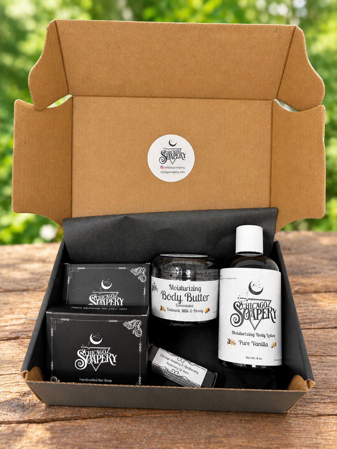 Open Mix & Match handmade gift box with two boxed soaps, body butter, lotion, and lip balm in mixed scents